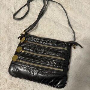 grey and gold crossbody purse w/ four compartments